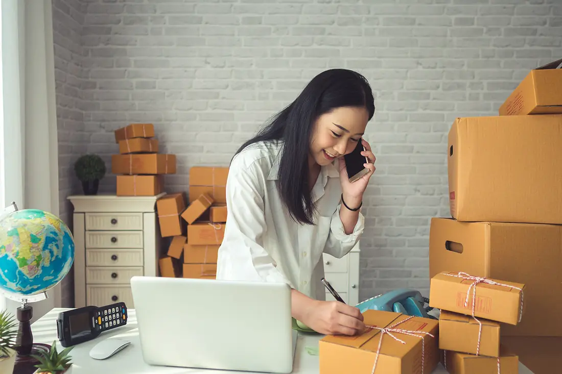 An owner on a call while packing orders: the specialist fits around the work.