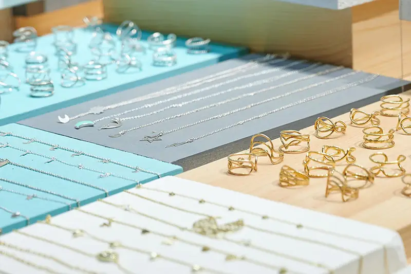A jeweller's trays of rings and chains: stock bought in when the season calls for it.