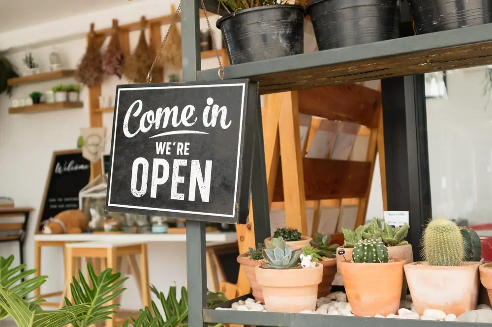 A 'come in, we're open' sign on a shop shelf: tell us about the business.